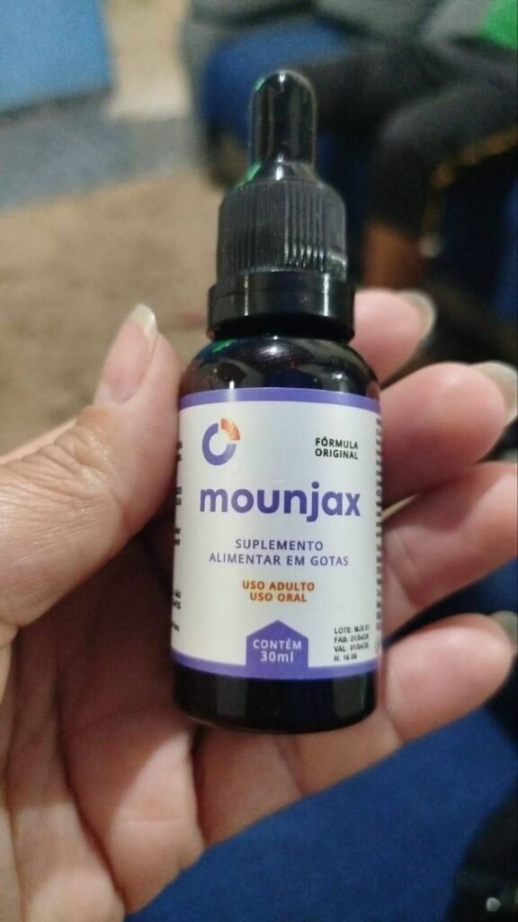 Foto real do frasco de Mounjax original, mostrando o rótulo nítido com informações de lote e validade na mão da nossa equipe.